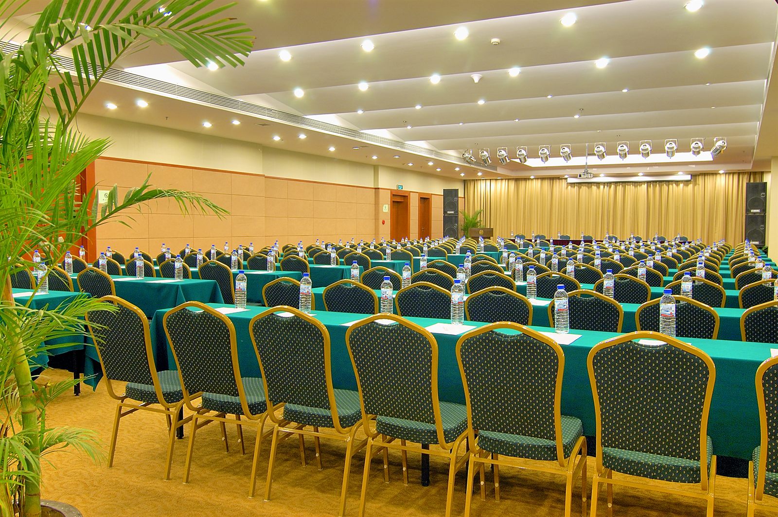 Meeting room set classroom style with rows of tables and chairs